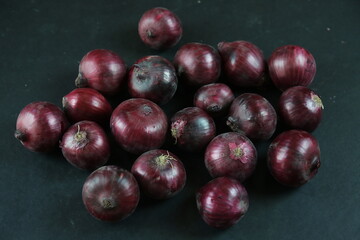 sweet red onions on background