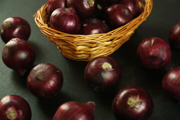 sweet red onions on background