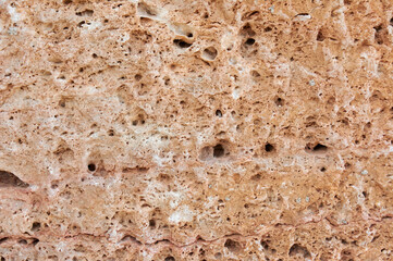 Textured stone, sandstone, limestone surface. Close image. Stone, natural abstract texture for backgrounds. Close up.  architecture.