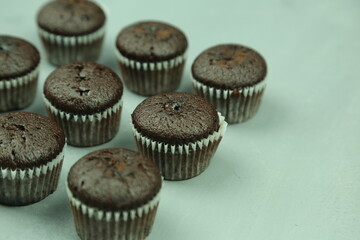 Chocolate cupcakes with colored background