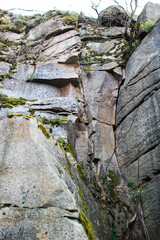 Large strong rocks are located above the water