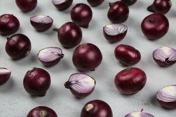 sweet red onions on background
