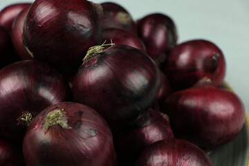 sweet red onions on background