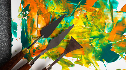 Set of oil color knifes. Painting spatulas. Palette knife and oil paints, closeup. Artistic tools concept