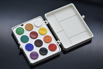 watercolor paints  isolated on a black background.