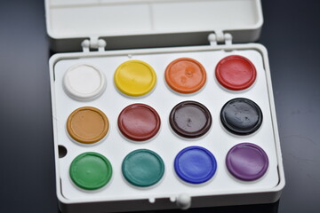 watercolor paints  isolated on a black background.