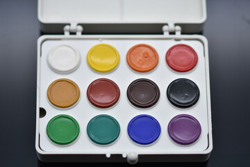 watercolor paints  isolated on a black background.