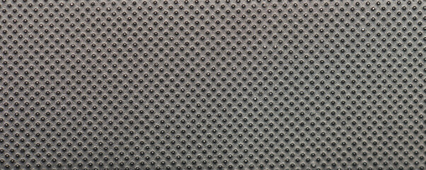 Dark metal surface with dots