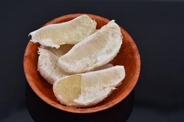 pomelo in a bamboo plate