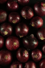 sweet red onions on background