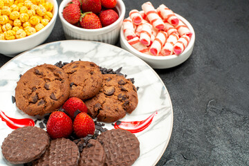 front view yummy choco biscuits with candies on dark background sweet cookie cake