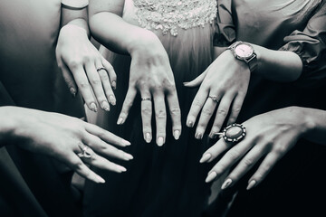 Bridesmaids show off their rings