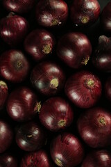 sweet red onions on background