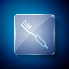 White Toothbrush icon isolated on blue background. Square glass panels. Vector.