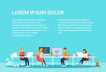 People work together in office. Men and women sitting at the desk with computers. Space for text.