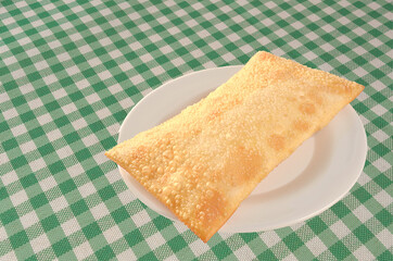 pastry served on checkered tablecloth table