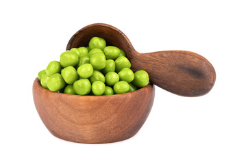 Canned green peas in wooden bowl and spoon, isolated on white background. Pickled green peas.