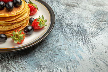 front view delicious pancakes with fruits and berries on dark background cake fruit dessert