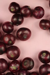 sweet red onions on background