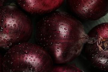 sweet red onions on background