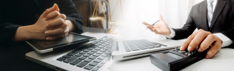 Business and lawyers discussing contract papers with brass scale on desk in office. Law, legal...