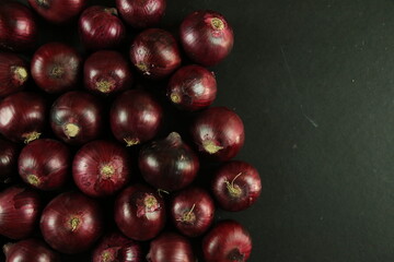 sweet red onions on background