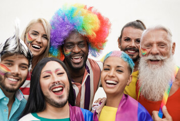 Cheerful multiracial people from different generations at gay pride parade - Concept of lgbt and...