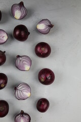 sweet red onions on background