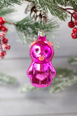 Old soviet decoration on the Christmas tree, glass toy teddy bear close up on light background