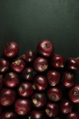 sweet red onions on background
