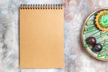 top view little creamy cake with fruits inside tray on light background biscuit sweet photo