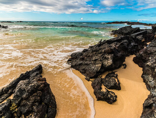 Fototapeta na wymiar The Lava Covered Shore Of Makalawena Beach, Kekaha Kai Beach Park, Hawaii, Hawaii, USA