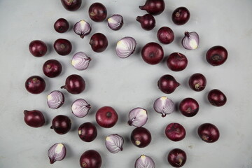 sweet red onions on background