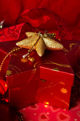 Christmas decorations and  present box at red background. Christmas holiday concept