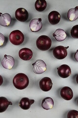 sweet red onions on background
