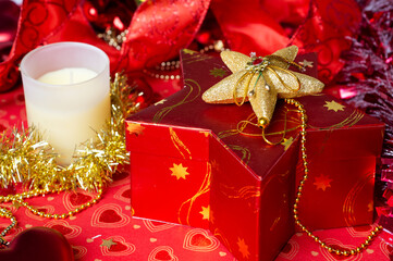 Christmas decorations and  present box at red background. Christmas holiday concept