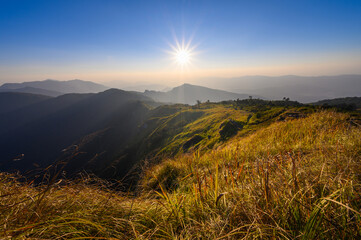 Beautiful mountain landscape at sunsest at Phu Chi fa or Phu Chee fah located in Chiang Rai province, Thailand