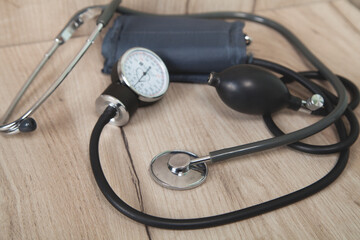 Pressure device on a wooden background.
