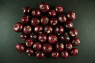 sweet red onions on background