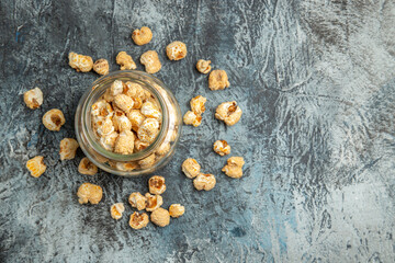 top view sweet popcorn inside glass can on light background snack movie cinema