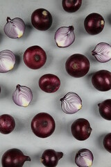 sweet red onions on background