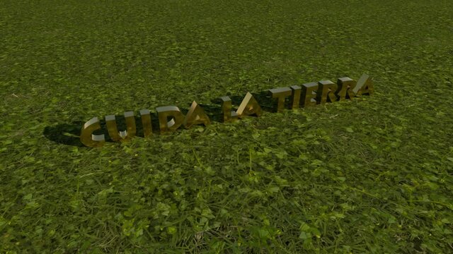 Cuida la tierra, letras 3d en oro sobre el pasto
