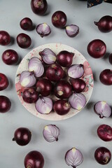 sweet red onions on background