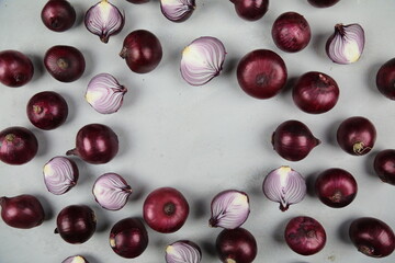 sweet red onions on background