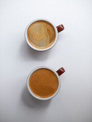 Two cups of coffees on white background