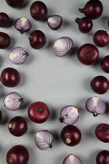 sweet red onions on background