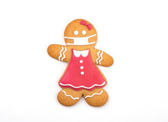 Gingerbread man with protective face mask isolated on white background