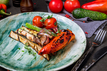 grilled vegetables on a plate on black concrete table