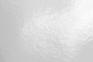 White glossy texture background with uneven surface