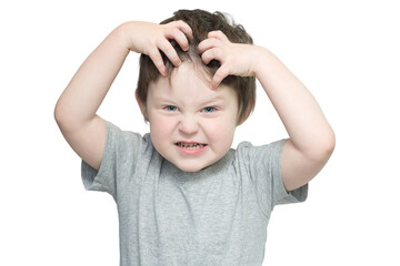 Portrait of a boy on a white background, with a funny expression. The child pretended to be angry...